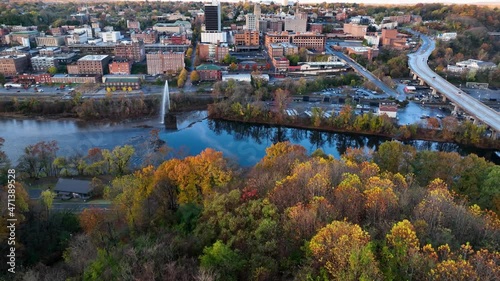 Aerial establishing shot of Lynchburg Virginia. Beautiful autumn fall foliage and reflections in James River. photo