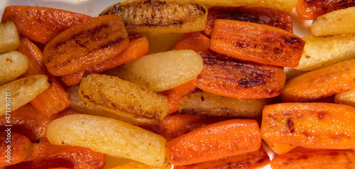 Chicken Hunter recipe with glazed root vegetables, carrot, turnip with its mushroom sauce deglazed in white wine and wet with the chicken stock photo