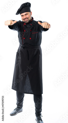 portrait of a male chef in a black suit, uniform with canned food, plate, basket, saucepan, frying pan or knives. isolated white background