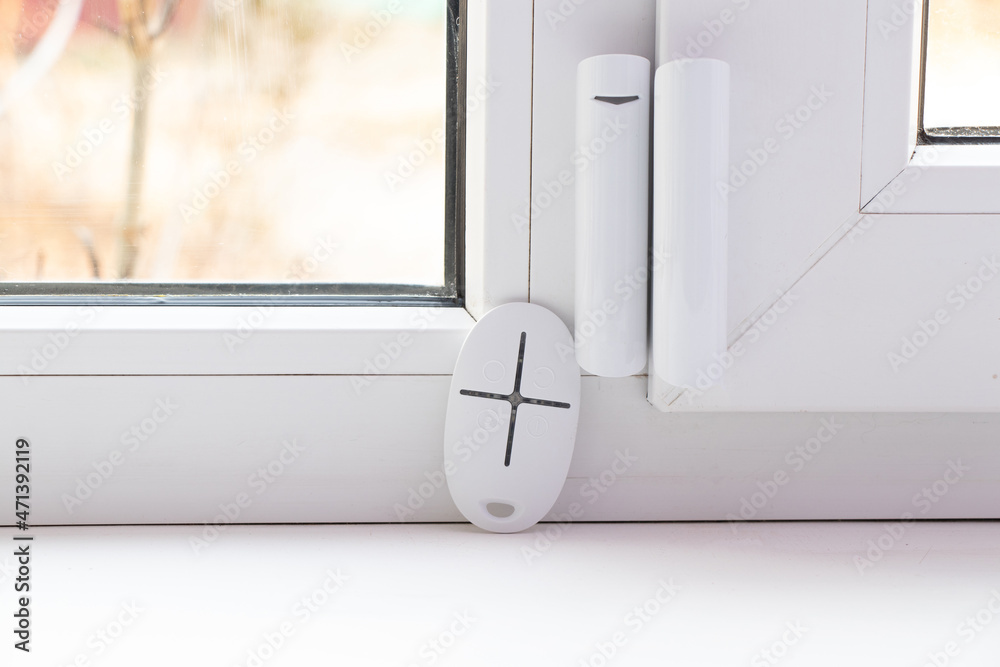 home security system on the windows, opening sensor and remote control