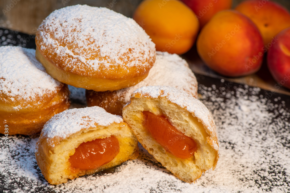 Freshly cooked Apricot jam doughnuts, referred to as jelly doughnuts, donuts in the US Freshly cooked Apricot jam doughnuts, referred to as jelly doughnuts, donuts in the US