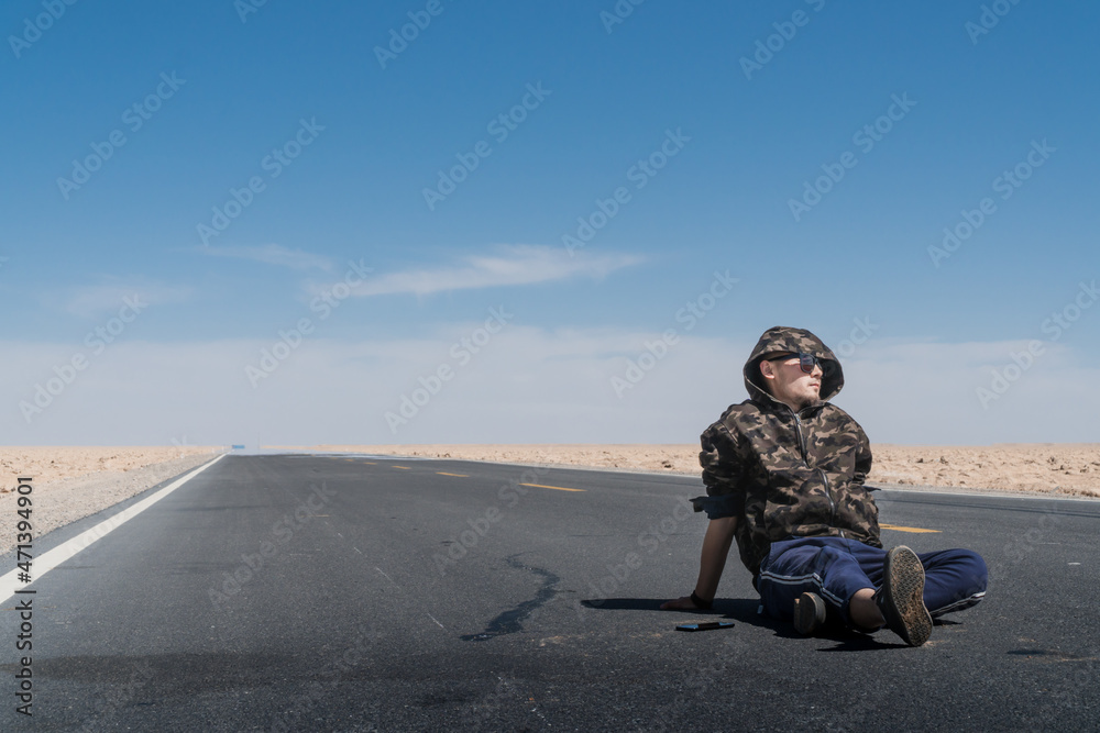 A man traveling in Xinjiang, China A man traveling in Xinjiang, China
