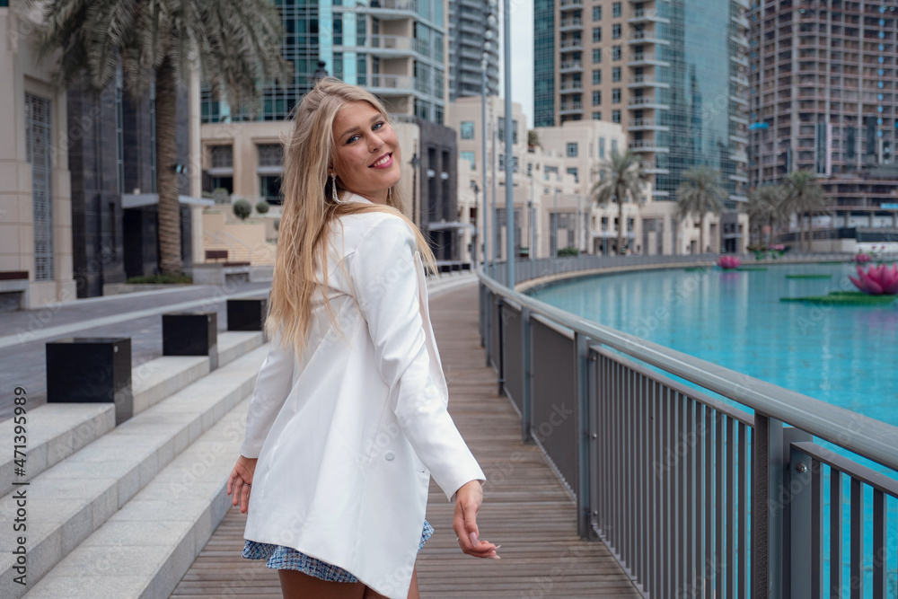 Young woman enjoying view of Dubai downtown. Young woman enjoying view of Dubai downtown.