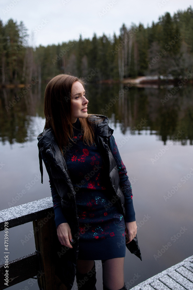 portrait of a beautiful woman on a frosty day. First snow portrait of a beautiful woman on a frosty day. First snow
