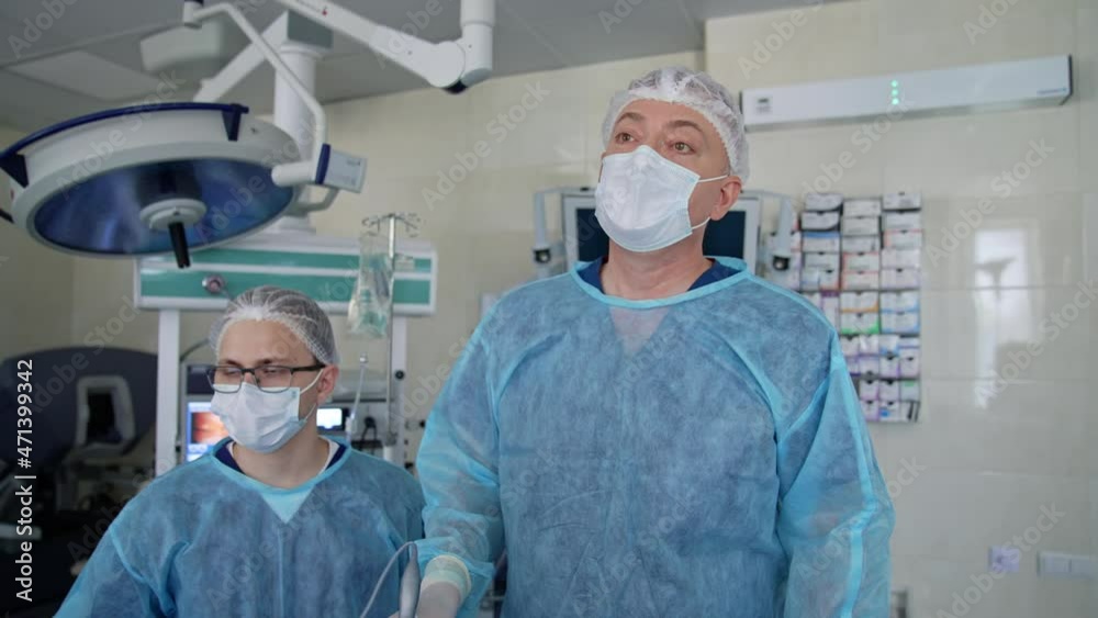 Endoscopic surgery on the monitor. Surgeons perform an operation and
