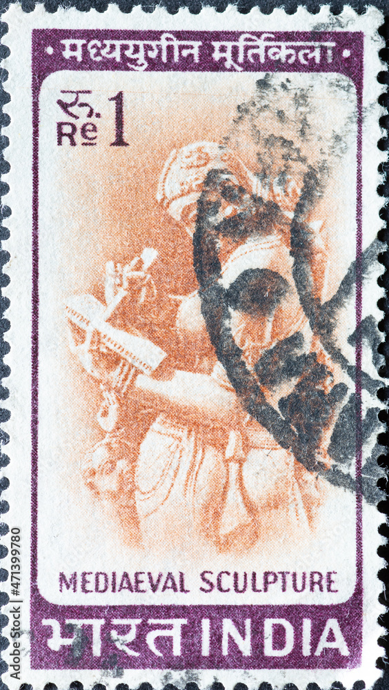 INDIA-CIRCA 1966: A post stamp printed in India showing a Woman writing ...