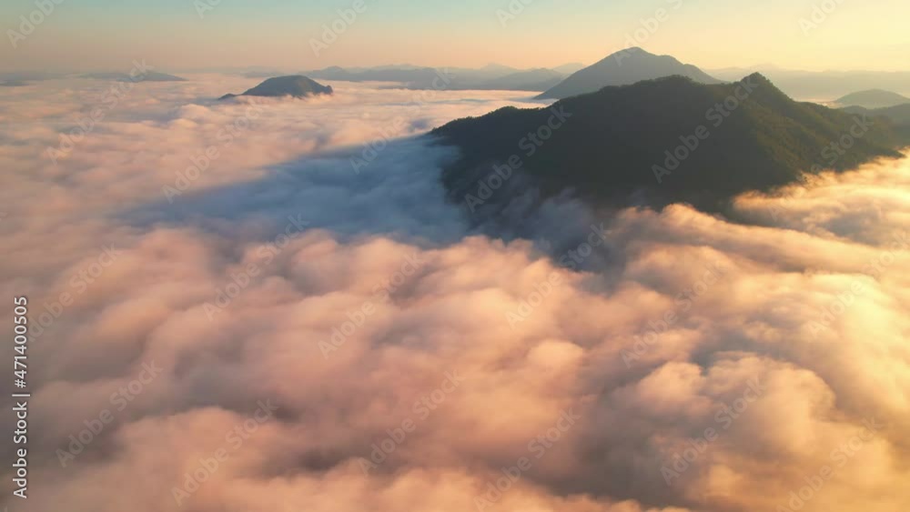 4K Aerial video Beautiful sunrise above dense clouds and fog in the morning, Cinematic drone shot.
4K Aerial video Beautiful sunrise above dense clouds and fog in the morning, Cinematic drone shot.