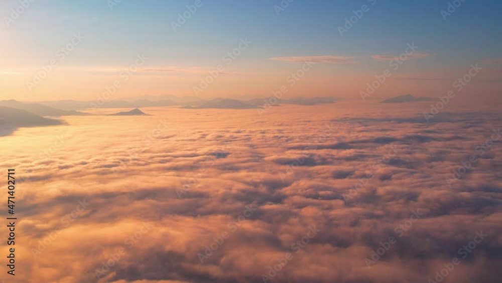 4K Aerial video Beautiful sunrise above dense clouds and fog in the morning, Cinematic drone shot.
4K Aerial video Beautiful sunrise above dense clouds and fog in the morning, Cinematic drone shot.