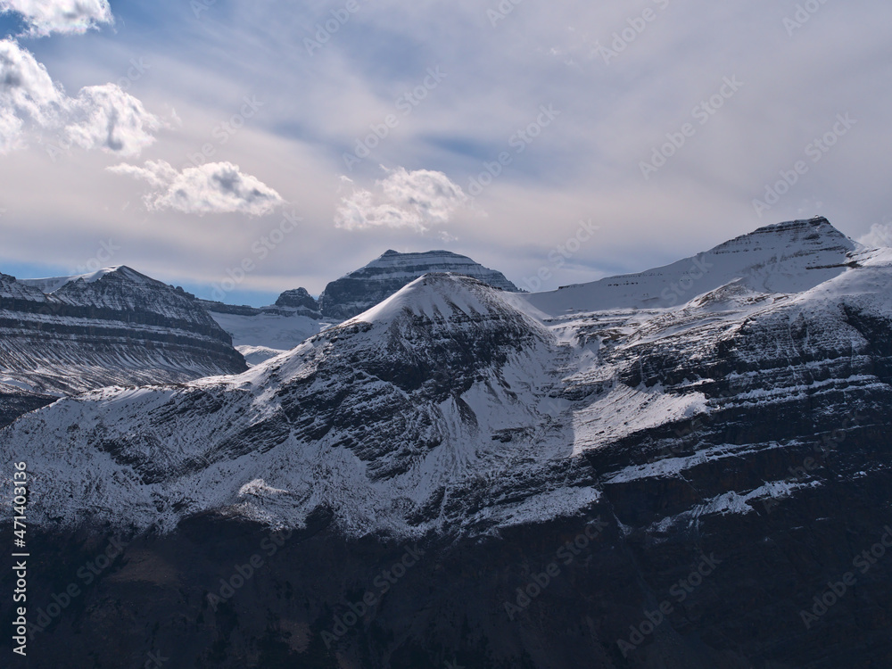 Obraz premium View of rugged mountain Big Bend Peak covered by ice and snow viewed from Parker Ridge in Banff National Park, Alberta, Canada in the Rockies.