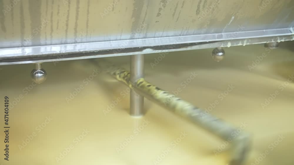 Butter production line at dairy industry. Close up view of butter production at dairy plant