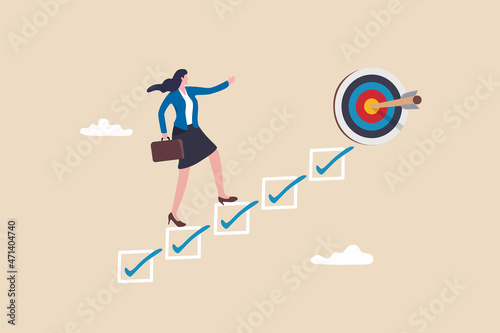 Personal development plan for career success, build specialist skill or competence to motivate and achieve business target concept, smart businesswoman walk up checklist as staircase to achieve target photo