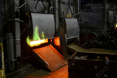 Industrial furnace in workshop of a forging plant for hardening steel at high temperature. Blacksmith and metallurgical industry, steelmaking, hot rolling mill. Heat treating. Shop in steel factory