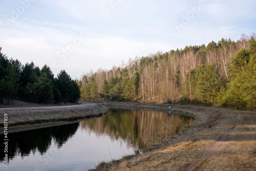 View of a small river in spring. Channel of the Vileyka-Minsk water system for the transfer of water flow