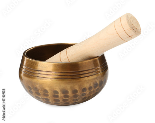 Golden singing bowl with mallet on white background. Sound healing