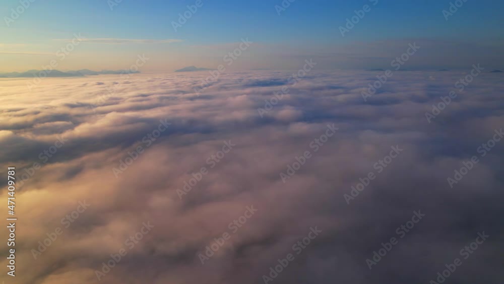 4K Drone flight over the clouds during sunrise. Sun is rising above sea of clouds until the horizon, bright weather and amazing nature landscape
4K Drone flight over the clouds during sunrise. Sun is rising above sea of clouds until the horizon, bright weather and amazing nature landscape