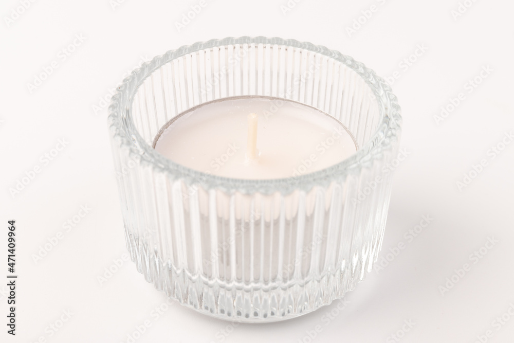 Many wax candles together on the white background Many wax candles together on the white background