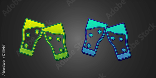Green and blue Glass of beer icon isolated on black background. Vector