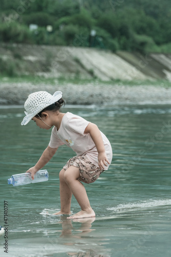 A girl playing with water in the tourist area