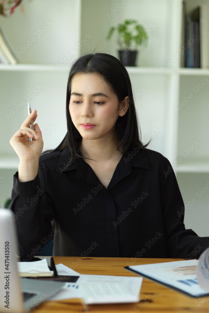 Businesswoman pensive thinking about her business Businesswoman pensive thinking about her business