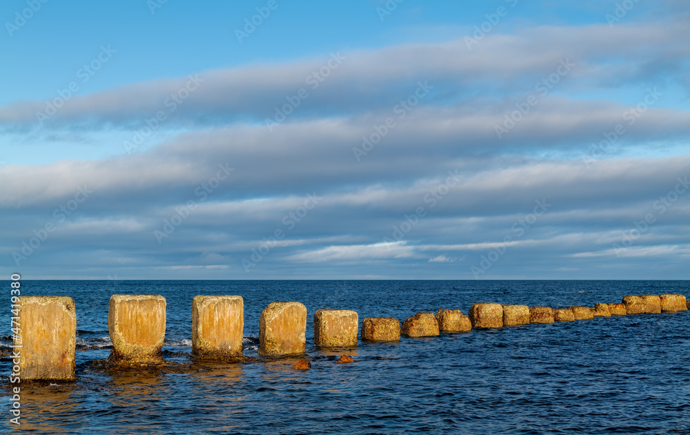 LOSSIEMOUTH, MORAY, SCOTLAND - 23 NOVEMBER 2021: - This is World War II concrete defence bollards at  West Beach of Lossiemouth, Moray, Scotland on a sunny 23 November 2021.