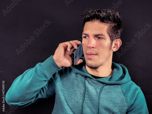 Handsome young man talking on the phone