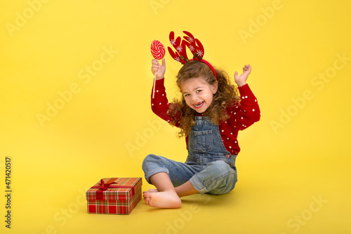 Portrait of little girl with Christmas gift box