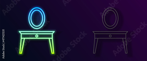 Glowing neon line Dressing table icon isolated on black background. Vector