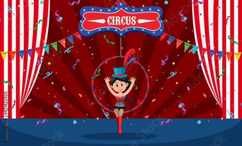 Stage scene with aerial female gymnast on ring