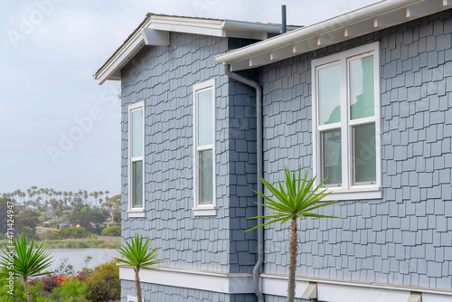 Side view of a house with light gray shingles sidings at La Jolla, California