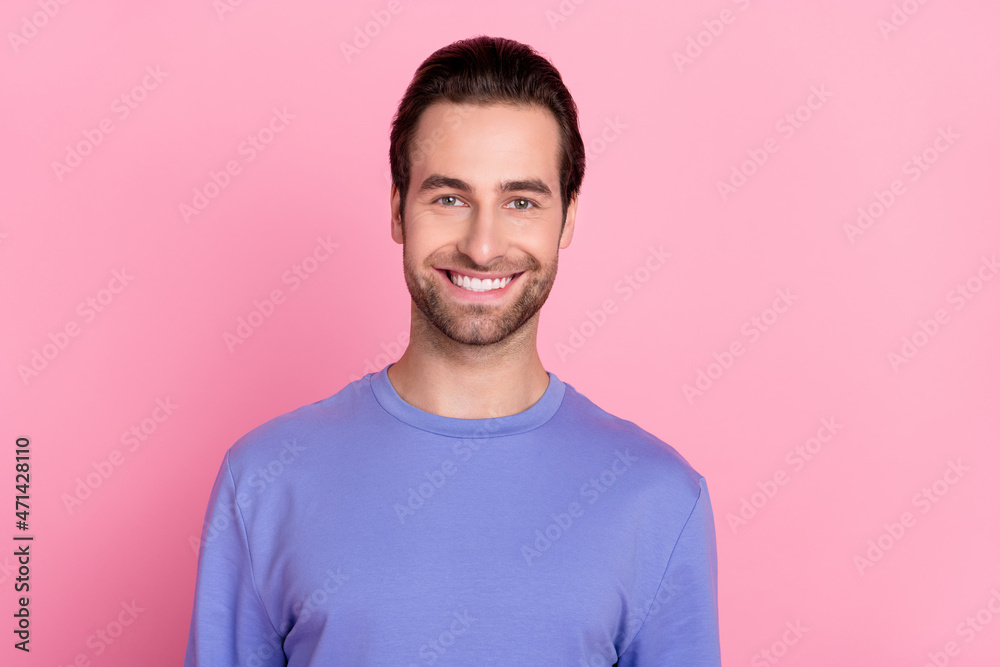 Photo of brunet optimistic young guy wear blue sweater isolated on pastel pink color background
