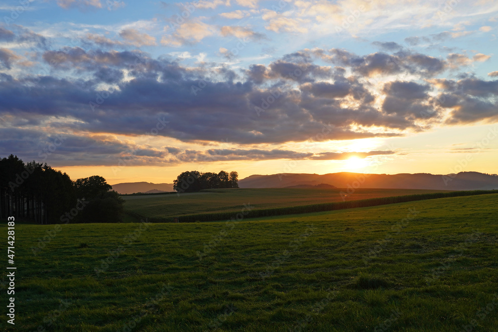Sunset in the Sauerland. Landscape with setting sun in the evening.