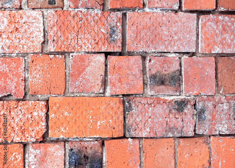The wall is made of red burnt brick. Brickwork. Red brick. Photo for the background.