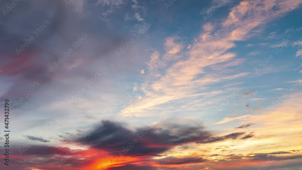 Orange clouds are changing shapes on the blue sky at sunrise. Sky sunrise cloud landscape. Orange clouds are changing shapes on the blue sky at sunrise. Sky sunrise cloud landscape.