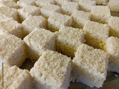 tasty white colored sandesh stock on factory photo