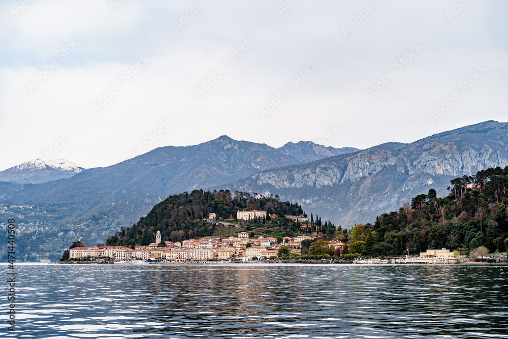 Expensive villas on the shores of Lake Como with mountains in the background. Bellagio, Italy