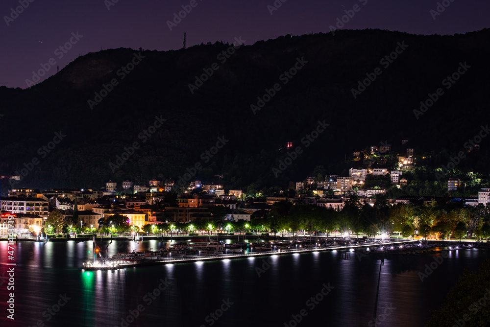 Panorama of the lakefront of Como, and of the outer dam with the Life Electric monument, in a summer evening. 