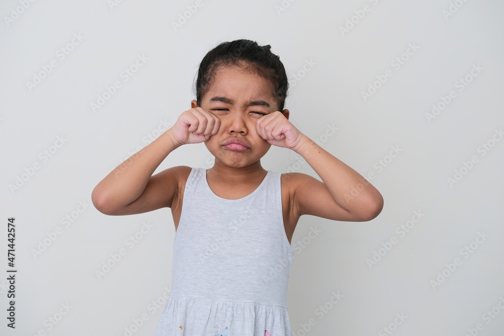 Asian little girl crying sad isolated on white background Asian little girl crying sad isolated on white background