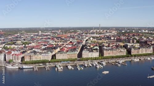 Aerial view urban cityscape of Stockholm. Coastline with berths on which moored boats in the city center with historic buildings. photo