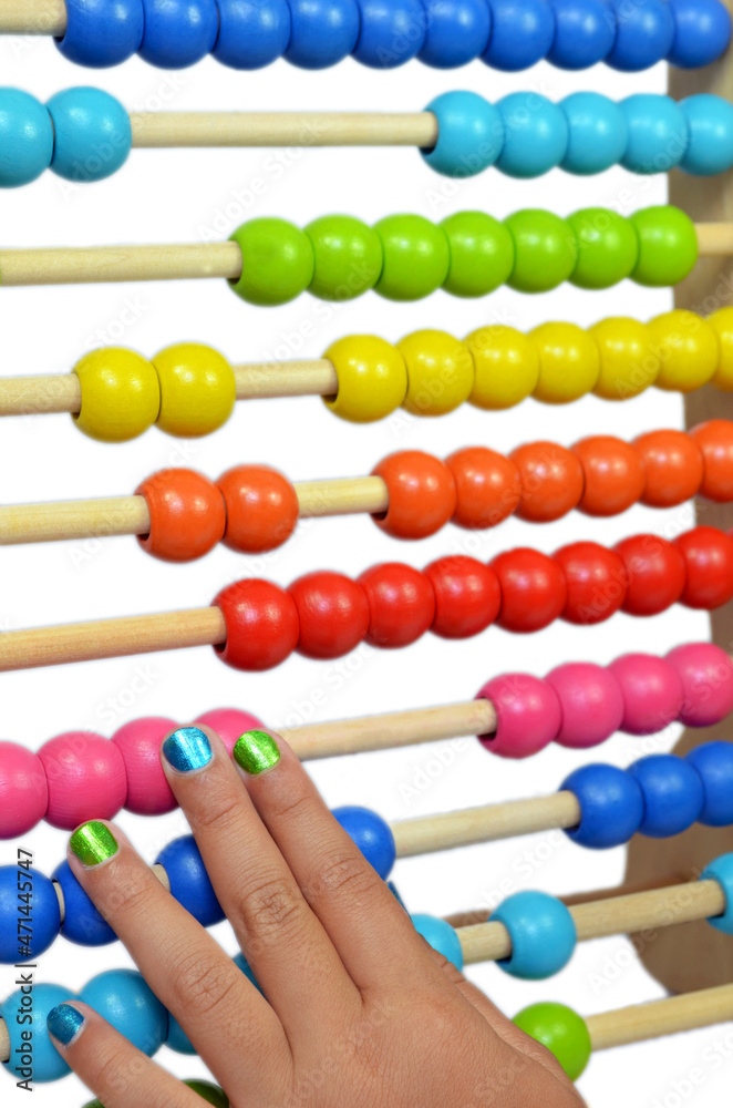 Child playing with a colorful Abacus with a isolated white Child playing with a colorful Abacus with a isolated white