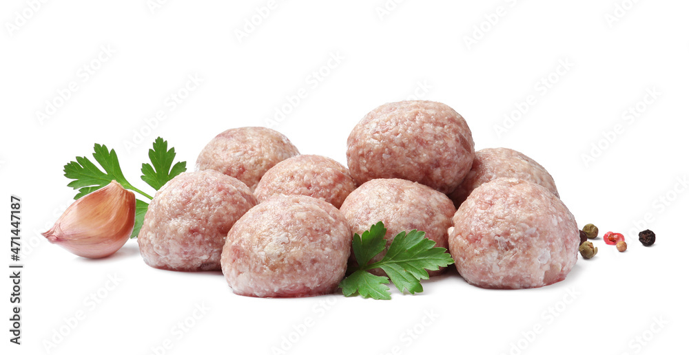 Many fresh raw meatballs with parsley and spices on white background Many fresh raw meatballs with parsley and spices on white background