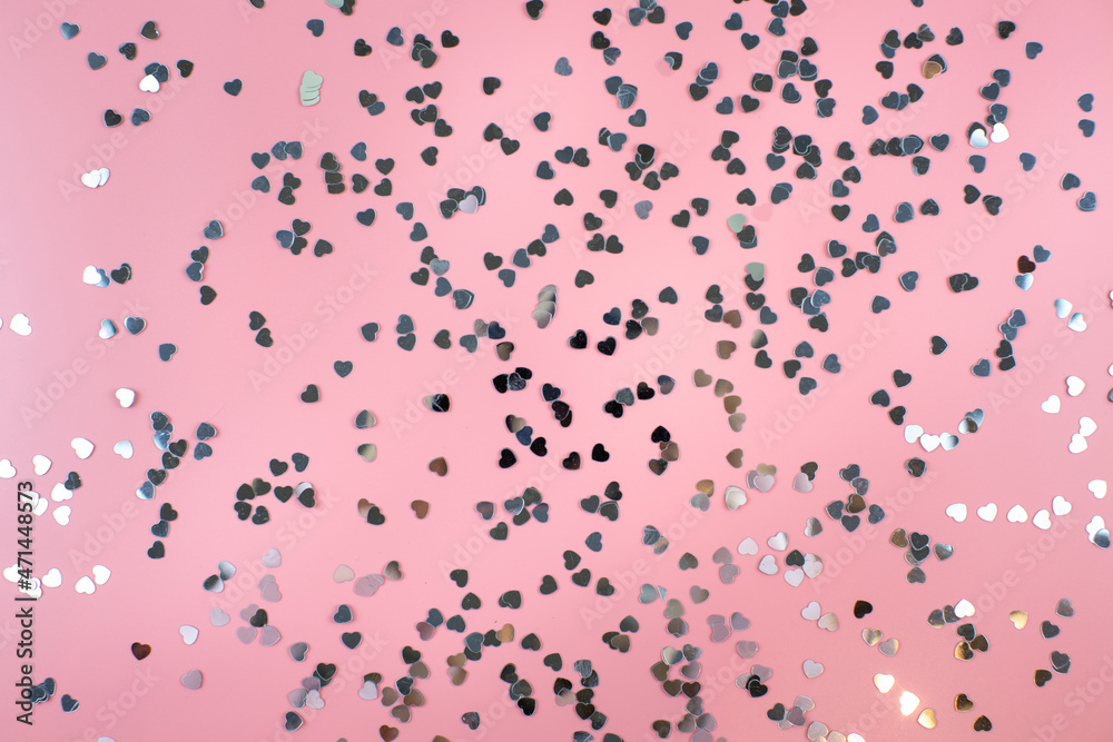 Small shiny hearts on a pink background Small shiny hearts on a pink background