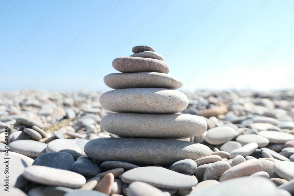 Zen rocks pile in a sunny beach in Valencia, Spain Zen rocks pile in a sunny beach in Valencia, Spain
