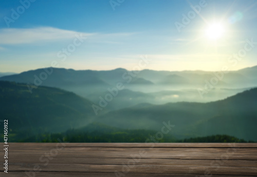 Empty wooden surface and beautiful view of mountain landscape on sunny day. Space for design © New Africa