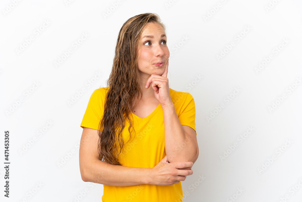 Young caucasian woman isolated on white background thinking an idea while looking up