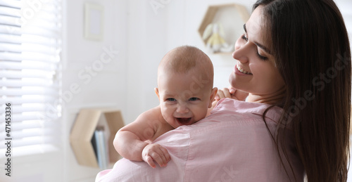 Mother with her cute baby at home. Banner design