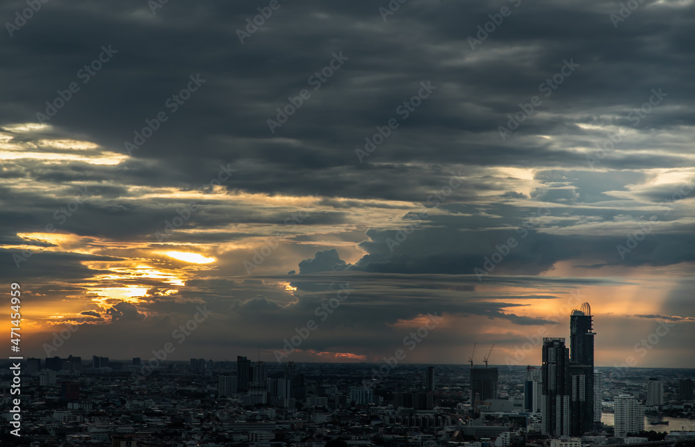 Bangkok, Thailand - Aug 29, 2021 : Gorgeous panorama scenic of the sunrise or sunset with cloud on the orange and blue sky over large metropolitan city in Bangkok. Copy space, No focus, specifically.