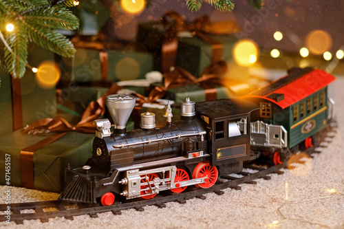 Toy train under Christmas tree