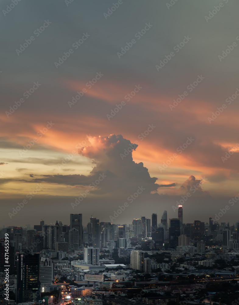 Bangkok, Thailand - Sep 17, 2021 : Aerial view of Beautiful sunset over large metropol city in Asia. With tall building and skyscraper in background. Monotone, No focus, specifically.
