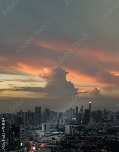 Bangkok, Thailand - Sep 17, 2021 : Aerial view of Beautiful sunset over large metropol city in Asia. With tall building and skyscraper in background. Monotone, No focus, specifically.