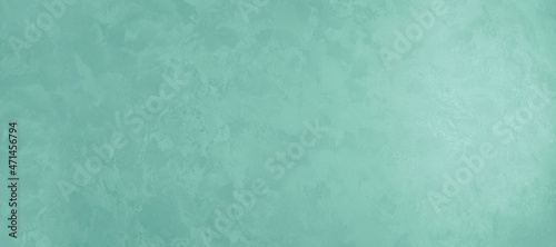 Green horizontal background with the texture of decorative plaster under silk for design